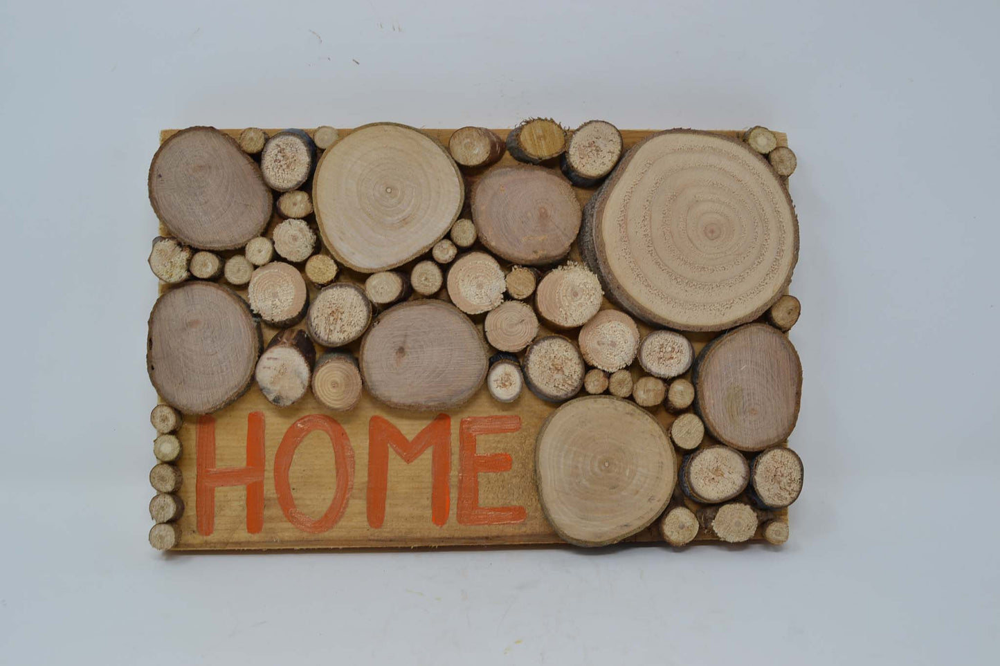Holz Wandbild aus Baumscheiben "Home"